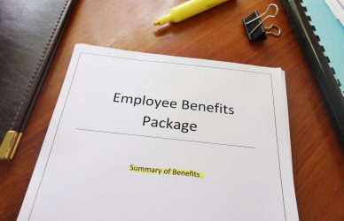 Packet of papers with yellow highlighter marker above the packet. The packet has black printed type Employee Benefits Package - Summary of Benefits is highlighted in yellow